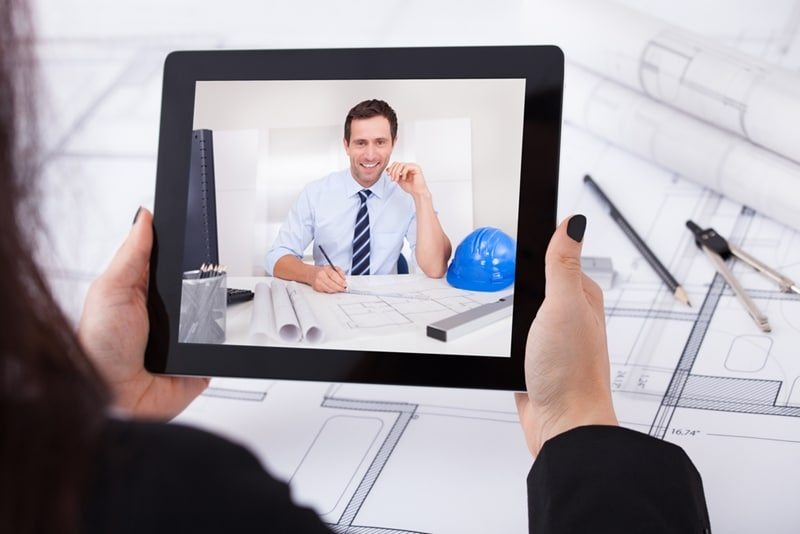 Business woman on video call to businessman